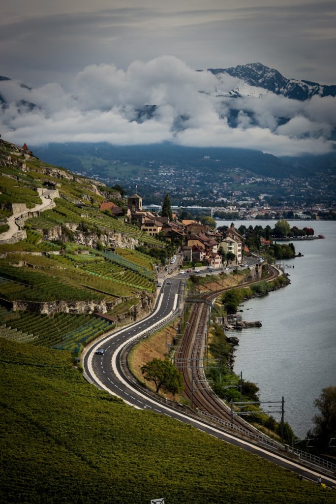 aerial view of city near body of water during daytime lausanne canton vaud